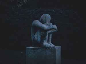 Bereavement and Loss Counselling. depressed statue